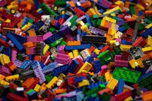 A pile of lego blocks of all colours.